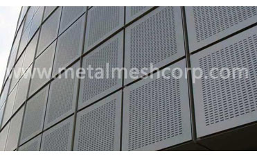What are the benefits of perforated metal façades?
